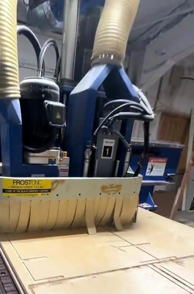 CNC machine cutting a full sheet of custom cabinet parts in the LuxeCraft shop in San Antonio